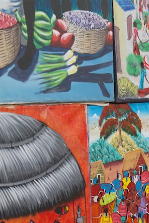 Unidentified man sells works of local artists at the street on November 08, 2012 in Santo Domingo, Dominican Republic.  Photo by Dmitry_Chulov/iStock Editorial / Getty Images Plus