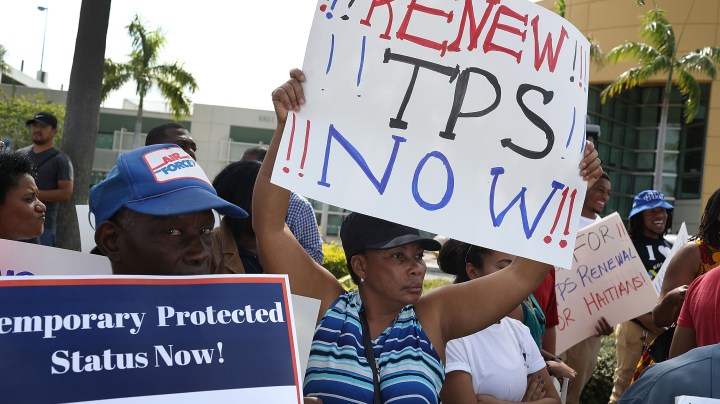 People protest the possibility that the Trump administration may overturn the Temporary Protected Status for Haitians in front of the U.S. Citizenship and Immigration Services office. Photo by Joe Raedle/Getty Images News