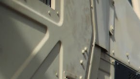 A resident carries food and water, provided by FEMA, in a neighborhood without grid electricity or running water on October 17, 2017 in San Isidro, Puerto Rico. Photo by Mario Tama/Getty Images