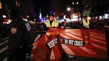 NYPD officers stand guard during the annual Halloween parade after a man driving a rental truck struck and killed eight people on a jogging and bike path in Lower Manhattan. Photo by Kena Betancur/Getty Images News