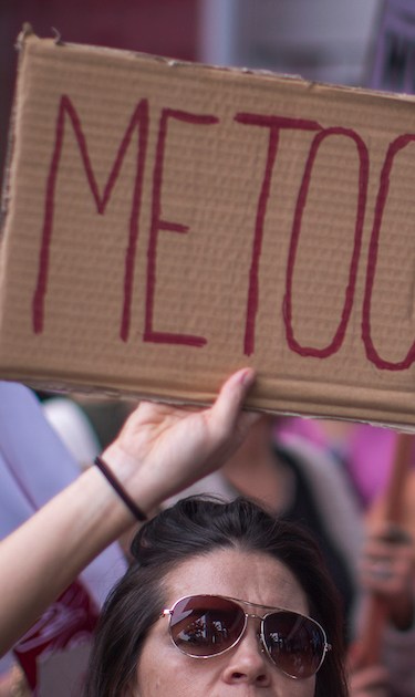 Demonstrators participate in the #MeToo Survivors' March in response to several high-profile sexual harassment scandals. Photo by David McNew/Getty Images News