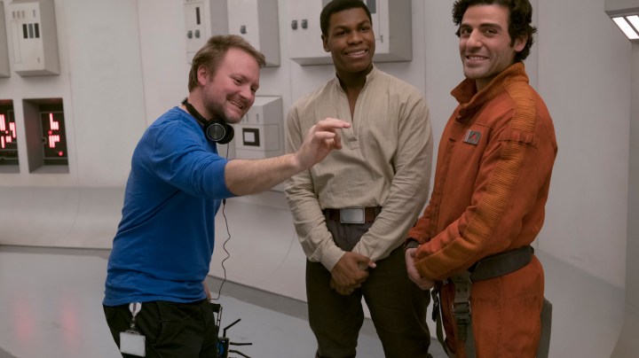 Director Rian Johnson on set with John Boyega (Finn) and Oscar Isaac (Poe Dameron). Photo: David James. ©2017 Lucasfilm Ltd. All Rights Reserved.
