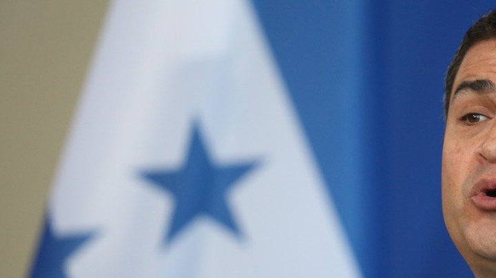 Honduran President Juan Orlando Hernandez speaks to the media with German Chancellor Angela Merkel following talks at the Chancellery on October 27, 2015 in Berlin, Germany. The two leaders discussed a variety of environmental, economic, political and law enforcement issues.  Photo by Sean Gallup/Getty Images News