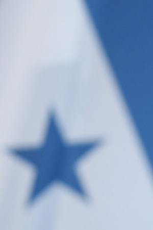 Honduran President Juan Orlando Hernandez speaks to the media with German Chancellor Angela Merkel following talks at the Chancellery on October 27, 2015 in Berlin, Germany. The two leaders discussed a variety of environmental, economic, political and law enforcement issues.  Photo by Sean Gallup/Getty Images News