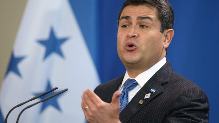 Honduran President Juan Orlando Hernandez speaks to the media with German Chancellor Angela Merkel following talks at the Chancellery on October 27, 2015 in Berlin, Germany. The two leaders discussed a variety of environmental, economic, political and law enforcement issues.  Photo by Sean Gallup/Getty Images News
