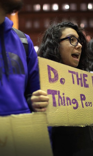 Demonstrators protest outside of the office of Senator Dick Durbin (D-IL) urging him to pass the Dream Act on December 19, 2017 in Chicago, Illinois. Photo by Scott Olson/Getty Images