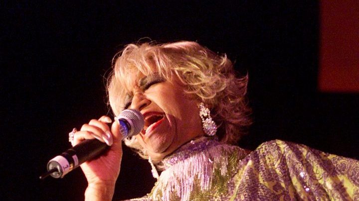 Celia Cruz performing at the "Concierto Para Los Heroes" benefit sponsored by The Recording Academy at the Beverly Hilton Hotel in Los Angeles, Ca. 9/14/01. The show will benefit the families of fallen firefighters and police officers of New York City. Photo by Kevin Winter/Getty Images.
