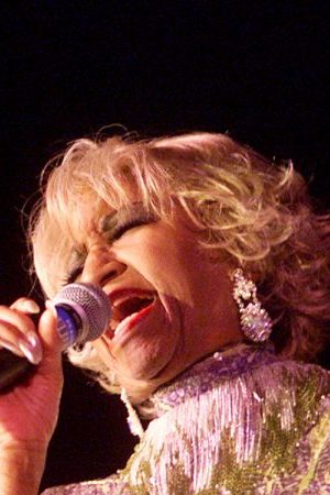Celia Cruz performing at the "Concierto Para Los Heroes" benefit sponsored by The Recording Academy at the Beverly Hilton Hotel in Los Angeles, Ca. 9/14/01. The show will benefit the families of fallen firefighters and police officers of New York City. Photo by Kevin Winter/Getty Images.