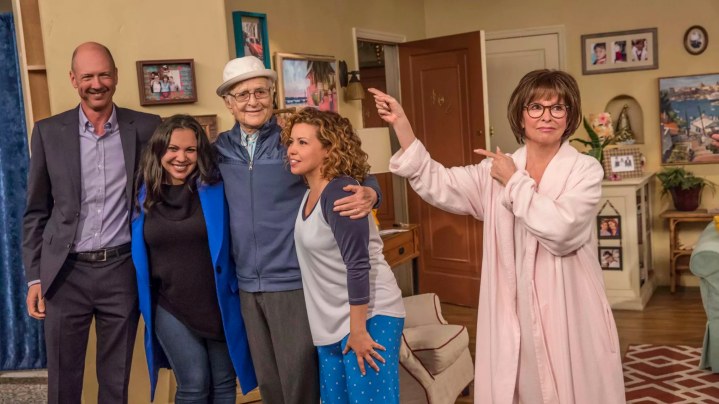 One Day at a Time’s showrunners Mike Royce (from left) and Gloria Calderon Kellett pose for a photo with executive producer Norman Lear and cast members Justina Machado and Rita Moreno. Courtesy of Netflix.