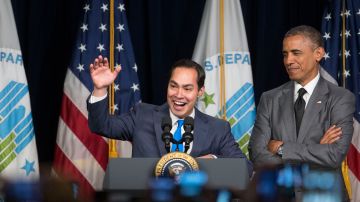 Julian Castro, secretary of U.S. Housing and Urban Development (HUD), center, gestures to employees as he and U.S President Barack Obama arrive to speak at the Department of Housing and Urban Development on July 31, 2014 in Washington, D.C. Castro, the former San Antonio, Texas mayor, was sworn in this week and will begin his duties on Monday, Aug. 4. Photo by Andrew Harrer-Pool/Getty Images