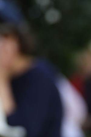 Emma Gonzalez is hugged as she joins  other people after a school shooting that killed 17 to protest against guns on the steps of the Broward County Federal courthouse. Photo by Joe Raedle/Getty Images