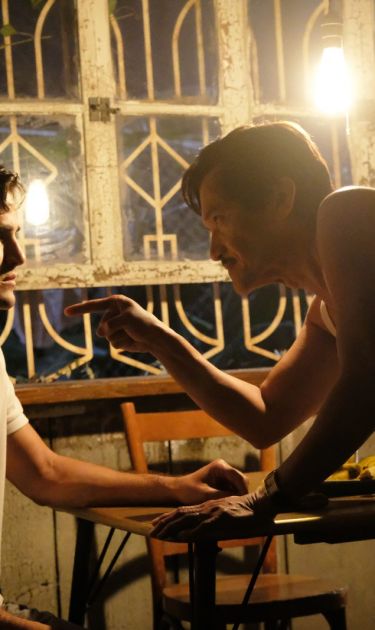 Darren Criss as Andrew Cunanan, Jon Jon Briones as Modesto Cunanan in ‘The Assassination of Gianni Versace: American Crime Story.’ Photo by Ray Mickshaw. Courtesy of FX
