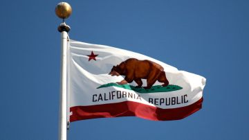 Creative Commons "The flag of California, flying at San Francisco City Hall, California" by Makaristos is in the public domain