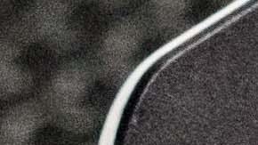 A volunteer helps Santiago Sánchez with email affairs at Poch@ House. Photo by Daniel M. Torres for Remezcla