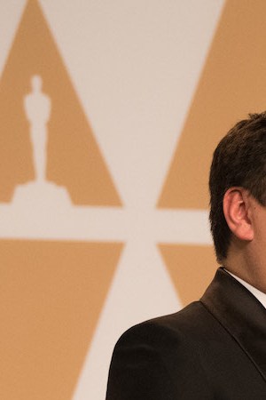 After winning the Oscar for original song for “Remember Me” from “Coco”, Robert Lopez and Kristen Anderson-Lopez pose backstage during the  The 90th Oscars on Sunday, March 4, 2018. Photo by Michael Yada. Courtesy of A.M.P.A.S.