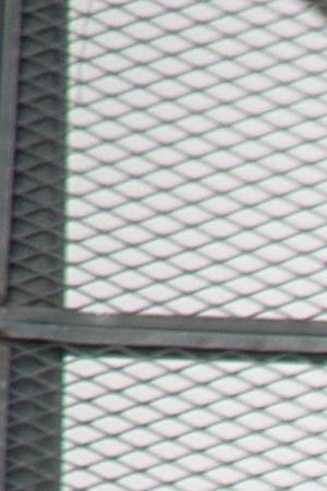 A flag hangs from a highway overpass that reads “Estamos de pie,” in Caguas, Puerto Rico, which is meant to motivate people to stay strong and overcome the disaster left behind Hurricane Maria. Photo by Airman 1st Class Caleb Nunez for  U.S. Air Force. This photo is licensed under CC BY 2.0.