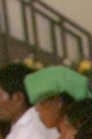 Guatemalan Mayan Quiche Indian women pray as they burn candles around 41 coffins of victims, found in a 1980's clandestine cemetery. Photo by Andrea Nieto/Getty Images