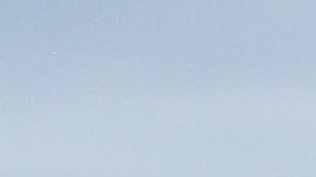 A PR resident carries bottled water, provided by FEMA. Photo by Mario Tama/Getty Images