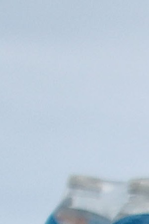 A PR resident carries bottled water, provided by FEMA. Photo by Mario Tama/Getty Images