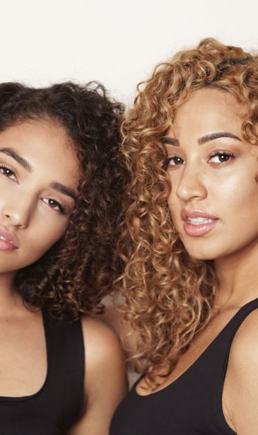 Cousins Susana Mendoza (left) and Julissa Prado (right), the owner of Rizos Curls. Photo courtesy of Julissa Prado.