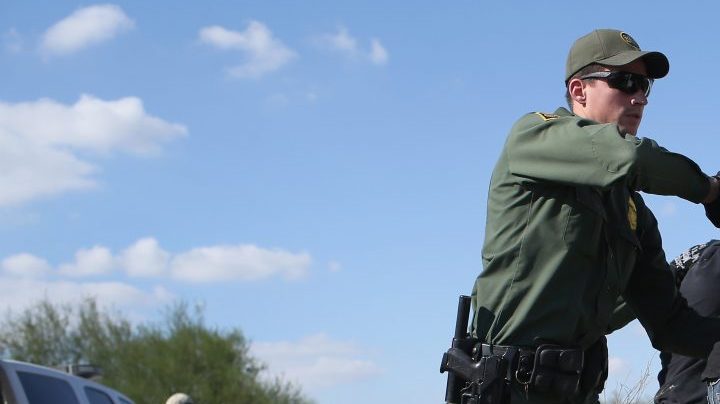 U.S. Border Patrol officer body searches an undocumented immigrant after he crossed the U.S.-Mexico border and was caught on December 7, 2015 near Rio Grande City, Texas. Photo by John Moore/Getty Images