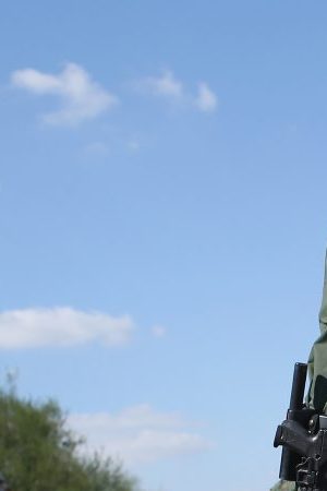 U.S. Border Patrol officer body searches an undocumented immigrant after he crossed the U.S.-Mexico border and was caught on December 7, 2015 near Rio Grande City, Texas. Photo by John Moore/Getty Images