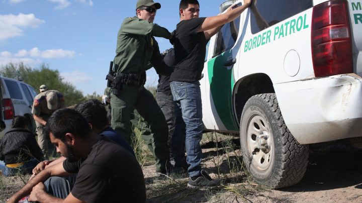 U.S. Border Patrol officer body searches an undocumented immigrant after he crossed the U.S.-Mexico border and was caught on December 7, 2015 near Rio Grande City, Texas. Photo by John Moore/Getty Images