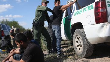 U.S. Border Patrol officer body searches an undocumented immigrant after he crossed the U.S.-Mexico border and was caught on December 7, 2015 near Rio Grande City, Texas. Photo by John Moore/Getty Images