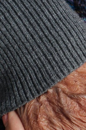 Zully Juarez, age 25, and Maria Gaspar Juan, age 96, holding hands. Maria is Zully’s great-grandmother. Photo by Emaly Escobar, age 17