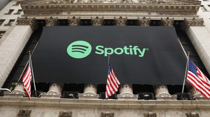 The Spotify banner hangs from the New York Stock Exchange (NYSE) on the morning that the music streaming service begins trading shares. Photo by Spencer Platt/Getty Images