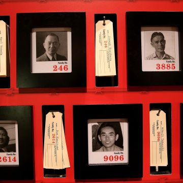 Pictures of people who were incarcerated at Manzanar War Relocation Center are displayed alongside family tags at Manzanar National Historic Site on December 9, 2015 near Independence, California. Photo by Justin Sullivan/Getty Images