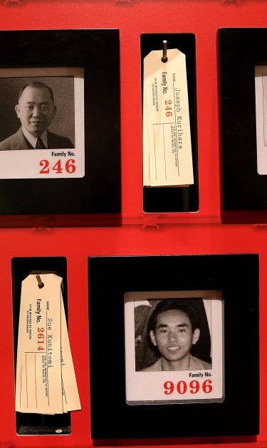 Pictures of people who were incarcerated at Manzanar War Relocation Center are displayed alongside family tags at Manzanar National Historic Site on December 9, 2015 near Independence, California. Photo by Justin Sullivan/Getty Images
