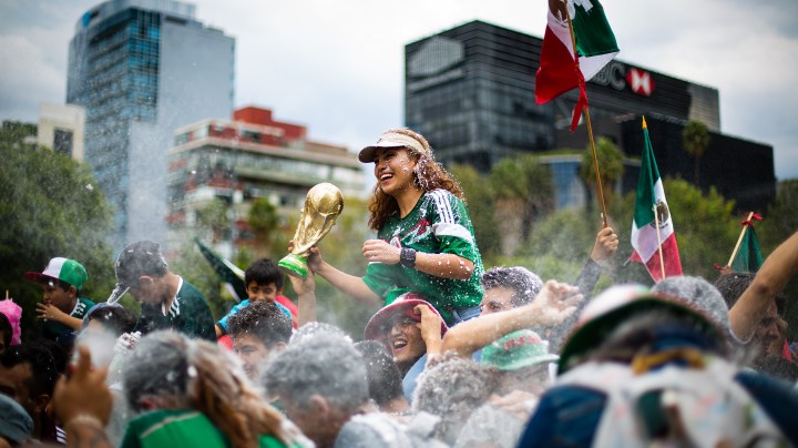 Mexicans celebrate at the Angel of Independence after the Mexico National Team victory over Germany. Photo by Manuel Velasquez / Getty Images