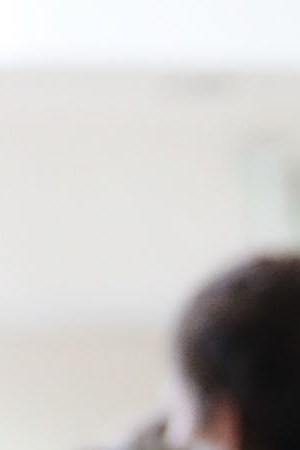 Dozens of women and their children, many fleeing poverty and violence in Honduras, Guatamala and El Salvador, arrive at a bus station following release from Customs and Border Protection in McAllen, Texas. Photo by Spencer Platt/Getty Images