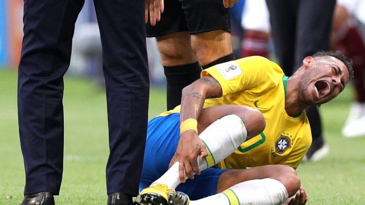 Neymar Jr of Brazil goes down injured during the 2018 FIFA World Cup (Photo by Buda Mendes/Getty Images)