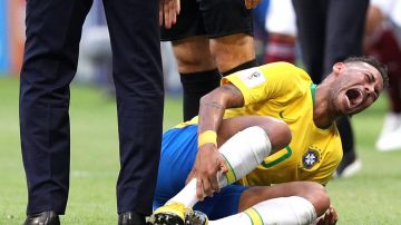 Neymar Jr of Brazil goes down injured during the 2018 FIFA World Cup (Photo by Buda Mendes/Getty Images)