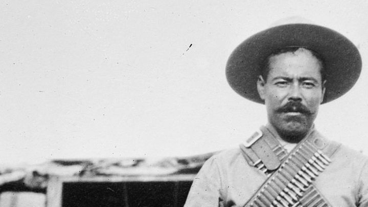 Francisco "Pancho" Villa (1877–1923), Mexican revolutionary general, wearing bandoliers in front of an insurgent camp. Photo courtesy of George Grantham Bain Collection
