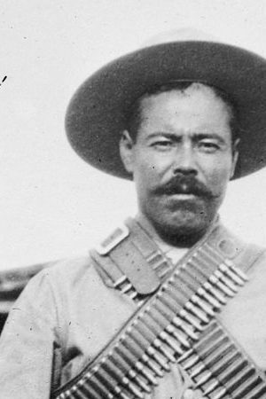 Francisco "Pancho" Villa (1877–1923), Mexican revolutionary general, wearing bandoliers in front of an insurgent camp. Photo courtesy of George Grantham Bain Collection