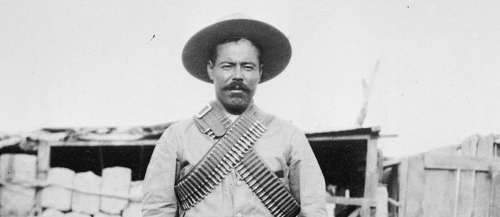 Francisco "Pancho" Villa (1877–1923), Mexican revolutionary general, wearing bandoliers in front of an insurgent camp. Photo courtesy of George Grantham Bain Collection