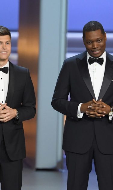 Colin Jost (L) and Michael Che speak onstage during 70th Emmy Awards on September 17, 2018 in Los Angeles, California. Photo by Kevin Winter/Getty Images