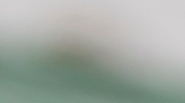 Center prepares to hike the football to the quarterback. Photo by 	fstop123/ E+