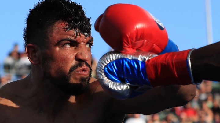 Victor Ortiz avoids a punch by Andre Berto during a welterweight fight at StubHub Center. Photo by Sean M. Haffey/Getty Images