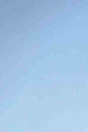 Mother Isamar holds her baby Saniel, 9 months, at their makeshift home, under reconstruction, after being mostly destroyed by Hurricane Maria, on December 23, 2017 in San Isidro, Puerto Rico. Photo by Mario Tama/Getty Images