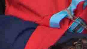 Members of a caravan of Central Americans who spent weeks traveling across Mexico walk from Mexico to the U.S. side of the border to ask authorities for asylum. Photo by David McNew/Getty Images