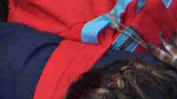 Members of a caravan of Central Americans who spent weeks traveling across Mexico walk from Mexico to the U.S. side of the border to ask authorities for asylum. Photo by David McNew/Getty Images