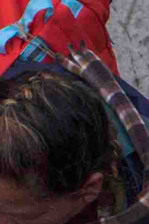 Members of a caravan of Central Americans who spent weeks traveling across Mexico walk from Mexico to the U.S. side of the border to ask authorities for asylum. Photo by David McNew/Getty Images