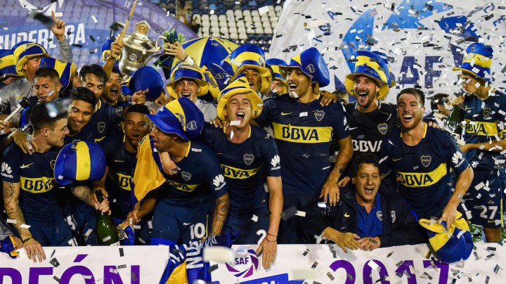 Carlos Tevez, Leonardo Jara and Ramon Abila of Boca Juniors celebrate with teammates after winning the Superliga 2017/18 against Gimnasia y Esgrima La Plata at Estadio Juan Carmelo Zerillo on May 9, 2018 in La Plata, Argentina. (Photo by Marcelo Endelli/Getty Images)
