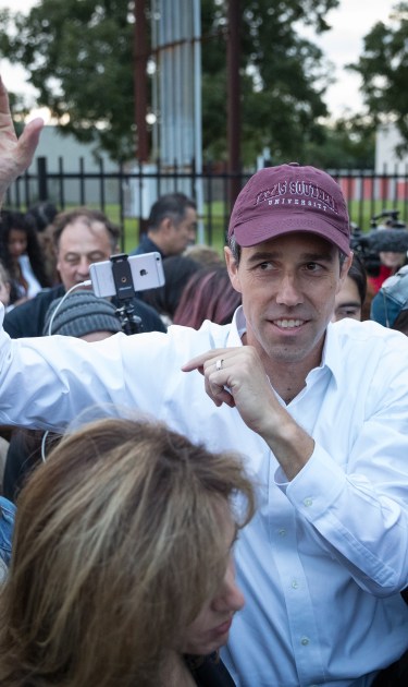 Democratic Senate candidate Beto O'Rourke greets supporters near a polling place on the first day of early voting. (Photo by Loren Elliott/Getty Images)