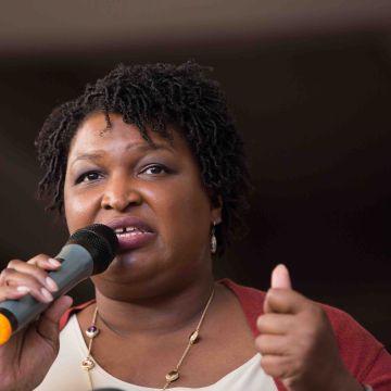 Democratic Georgia Gubernatorial candidate Stacey Abrams talks to a crowd gathered for the "Souls to The Polls" march in downtown Atlanta on October 28, 2018.  Photo by Jessica McGowan/Getty Images