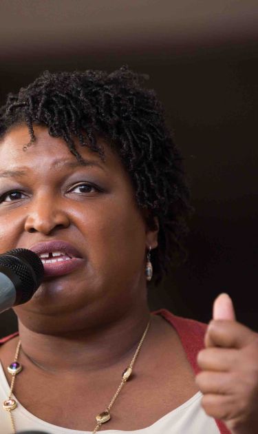 Democratic Georgia Gubernatorial candidate Stacey Abrams talks to a crowd gathered for the "Souls to The Polls" march in downtown Atlanta on October 28, 2018.  Photo by Jessica McGowan/Getty Images